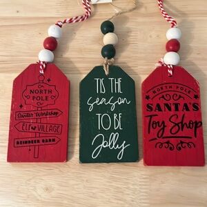 Set of three Christmas stocking tags with beaded hangers